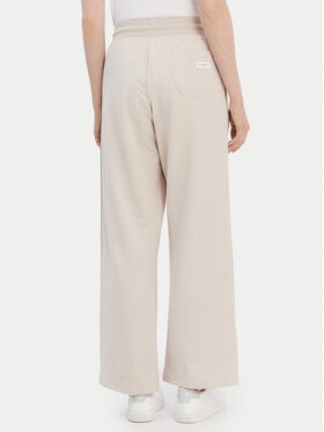 Tommy Hilfiger Spodnie dresowe UW0UW04771 Beżowy Relaxed Fit