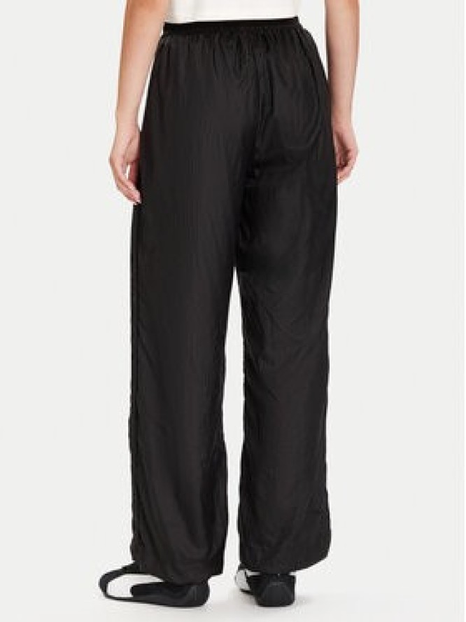 Puma Spodnie dresowe PUMA X ROSÉ T7 633796 01 Czarny Relaxed Fit