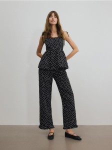Spodnie w groszki z falbanką - czarny