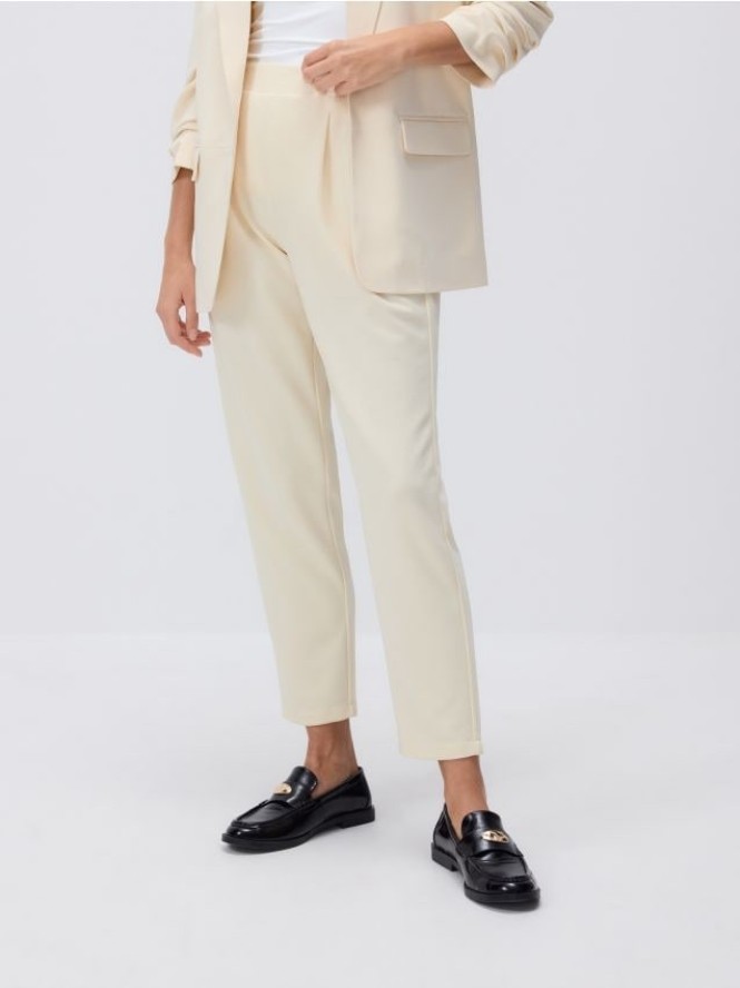 Spodnie jogger z zakładkami - jasnożółty