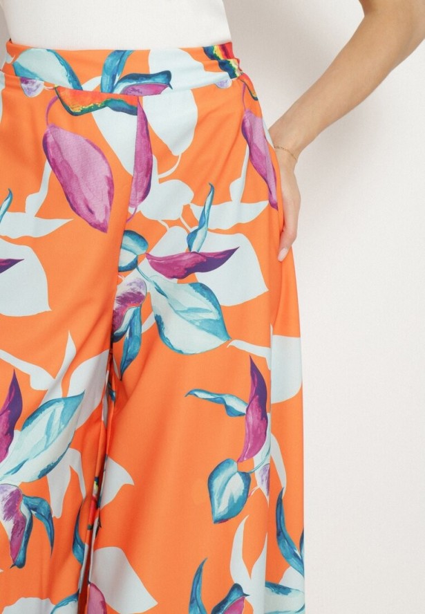 Pomarańczowe Spodnie Wiskozowe Szerokie we Florystyczny Print Orelvia