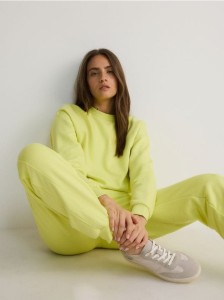 Dresowe spodnie jogger z bawełną - jasnozielony