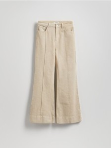 Jeansy flare z przeszyciem - złamana biel