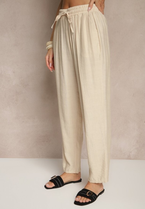 Beżowe Spodnie z Bawełną Ozdobione Wiązaniem Voreia