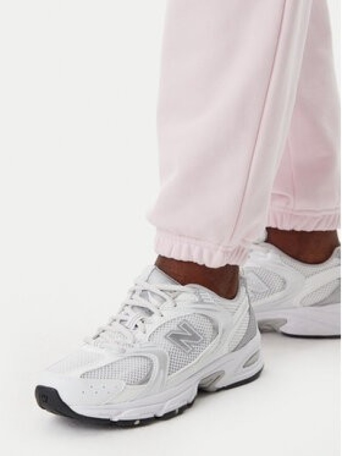 New Balance Spodnie dresowe Essentials WP41500 Różowy Relaxed Fit