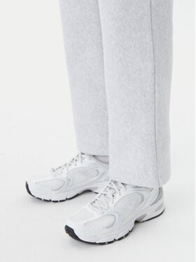 Champion Spodnie dresowe 117983 Szary Slim Fit