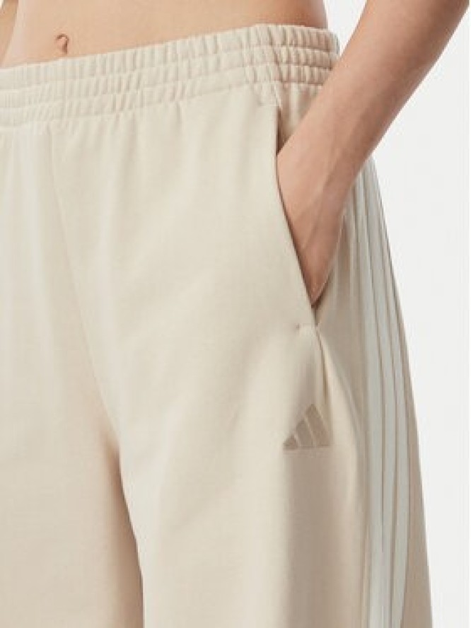 adidas Spodnie dresowe Kit 3-Stripes Wide KV9913 Beżowy Relaxed Fit