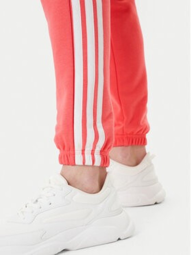 adidas Spodnie dresowe Essentials 3-Stripes KE4387 Koralowy Regular Fit