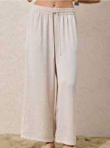 Spodnie wide leg z wiązaniem - kremowy