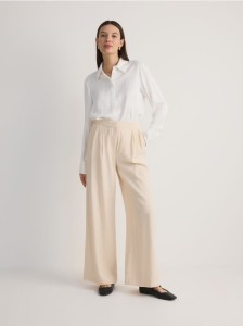 Szerokie spodnie z zakładkami - złamana biel