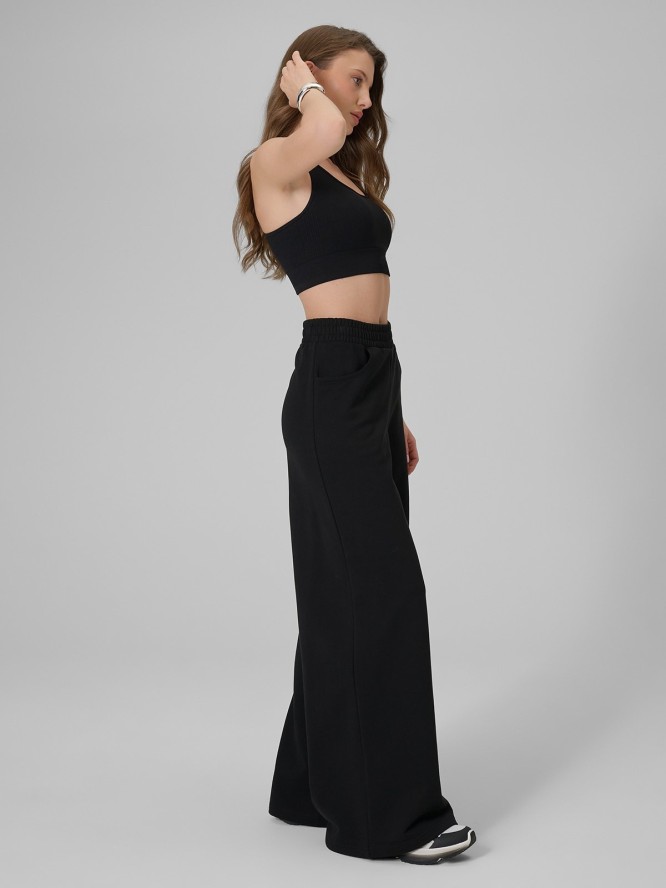 4F Spodnie dresowe z szerokimi nogawkami damskie - czarne S