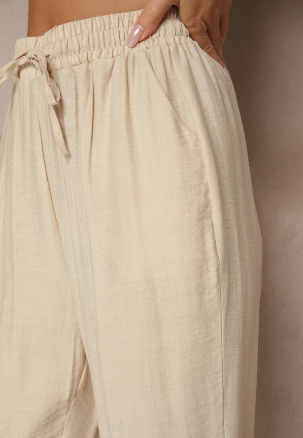 Beżowe Spodnie z Bawełną Ozdobione Wiązaniem Voreia