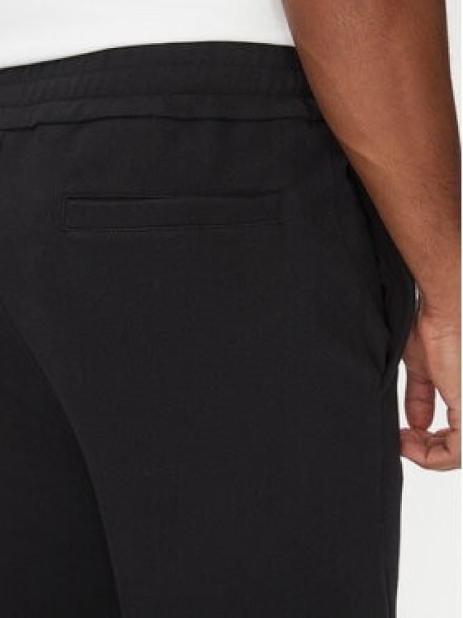 Filling Pieces Spodnie materiałowe Unisex Coach 7613397 Czarny Regular Fit