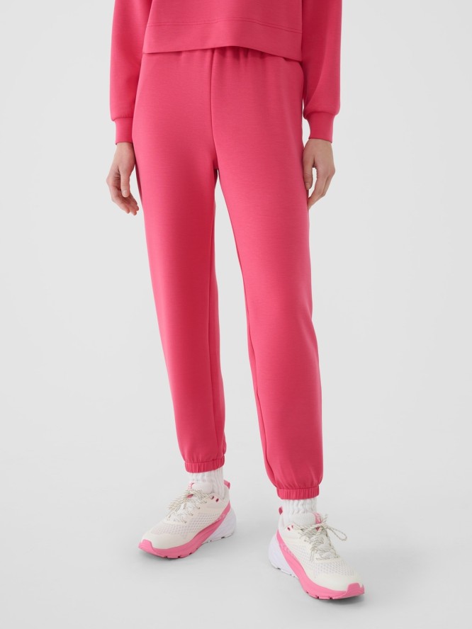 4F Spodnie dresowe joggery z modalem damskie - różowe XS